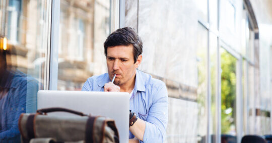 A man on his laptop learning about the beenverified opt out process