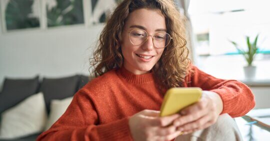 A young woman discovers how to opt out of Infotracer on her phone.