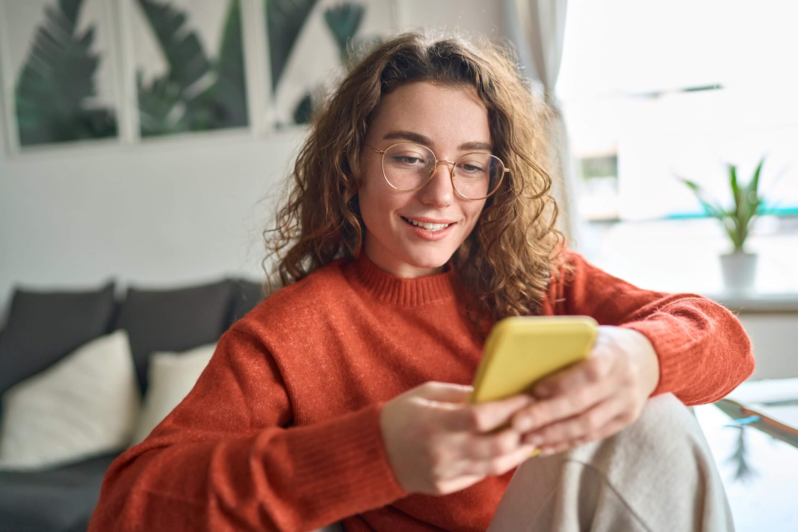 A young woman discovers how to opt out of Infotracer on her phone.