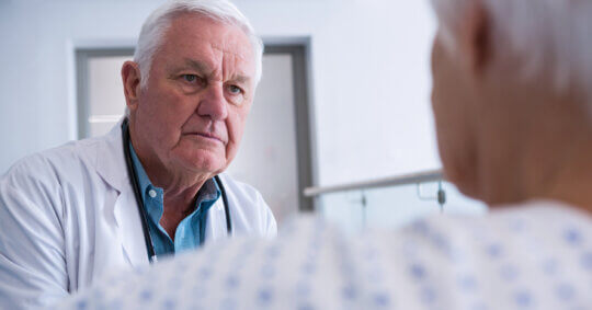 Older man and doctor discussing Medicare opt outs.
