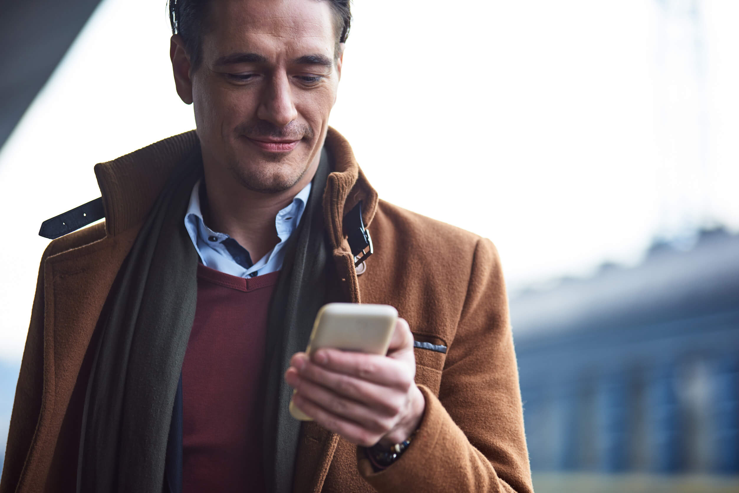 A man using his phone to complete the Discord opt out process.
