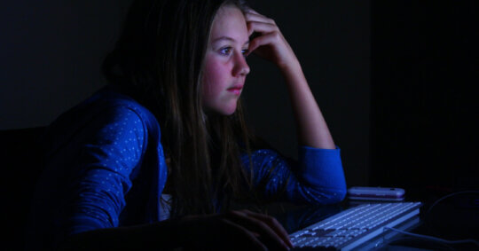 A woman using a computer to complete the One Call Now opt out process.