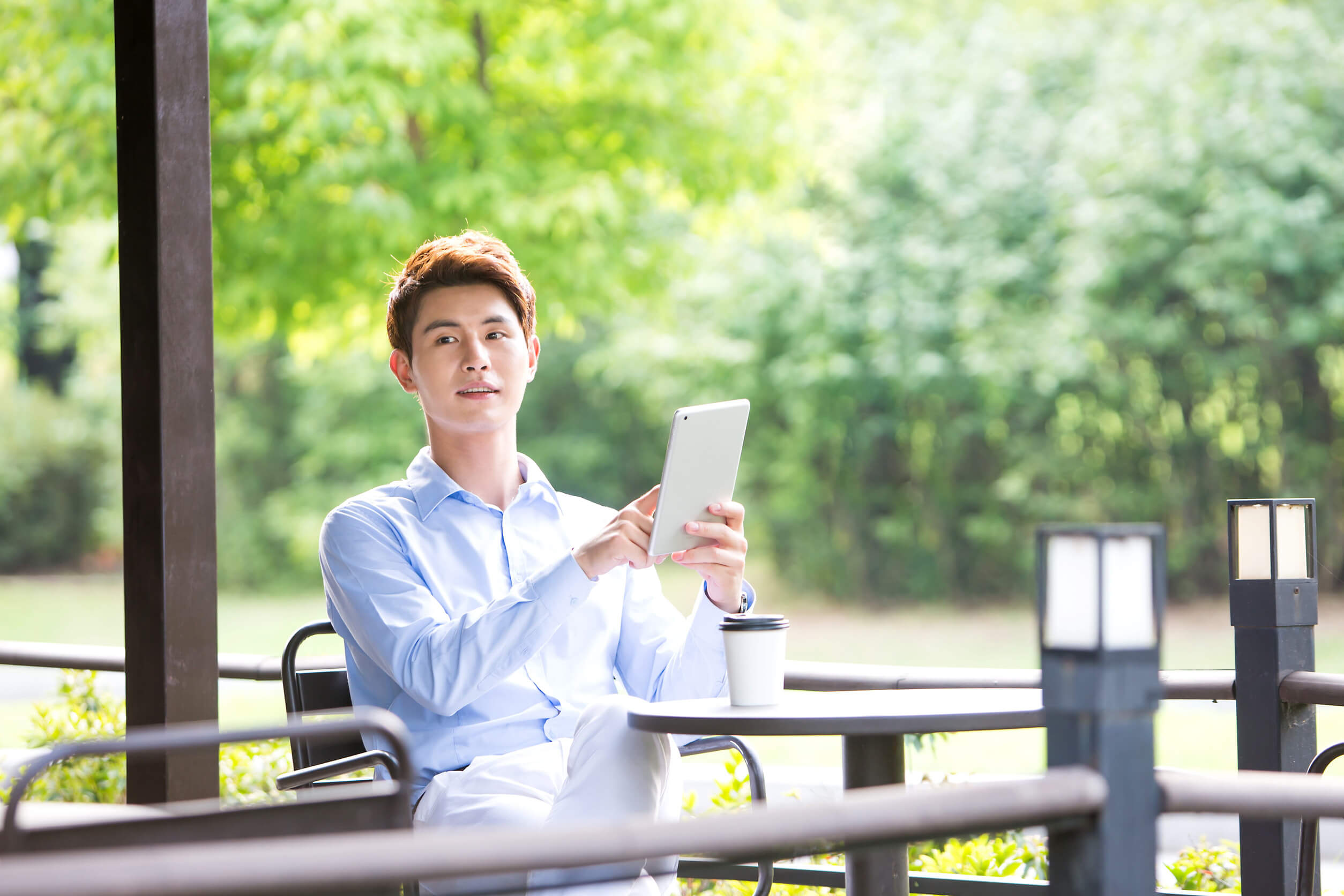 A man using a tablet outside after learning about the OfficialUSA opt out process.